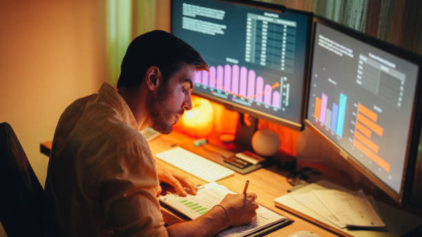 istock Businessman at home working late 1463408270