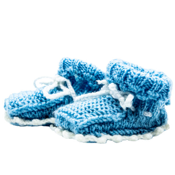 a pair blue knitted baby shoes, transparent background