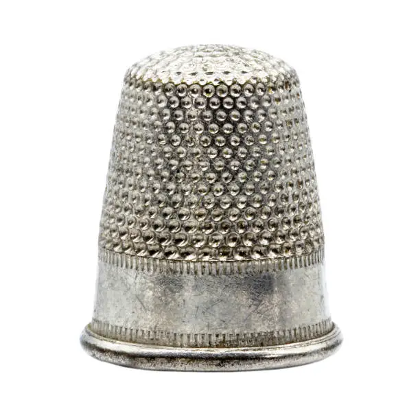 one single metal thimble for sewing protection, transparent background
