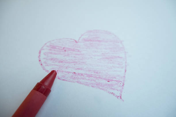 istock selective focus on the love symbol drawn by hand using colored pencils, soft focus 1463418802