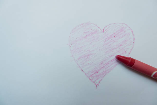 istock selective focus on the love symbol drawn by hand using colored pencils, soft focus 1463418803