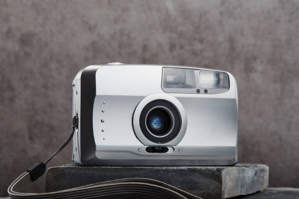 istock Silver colored point and shoot film camera 1463419311