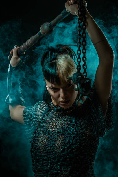 A Beautiful brunette Viking warrior witch woman with an authentic weapon