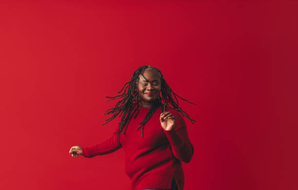 istock Excited black woman dancing and whipping her dreadlocks 1463423650