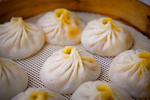 Shanghai style tang bao. Inside of bun have a lot of hot stock and different kind of filling such as pork and shrimps.