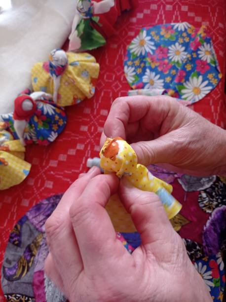 istock with our own hands, we make a cloth doll with a child 1463430599