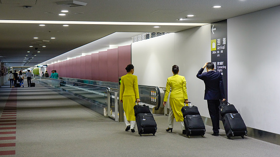 Nagoya, Japan - Mar 16, 2018. Vietnam Airlines crew members walking at Nagoya Chubu Centrair Airport (NGO).