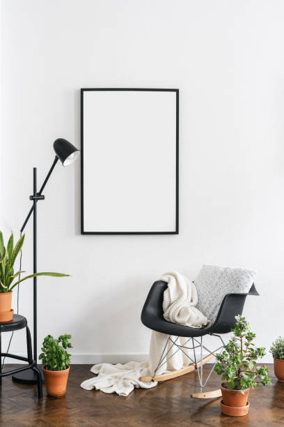 istock comfort armchair with soft blanket and empty poster on wall 1463435832