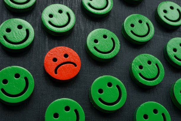 istock Happy smileys and one sad. Customer experience and satisfaction concept. 1463437726