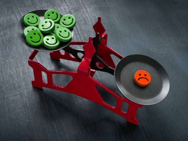 istock Scales with happy emoticons and sad. Negativity Bias concept. 1463437809