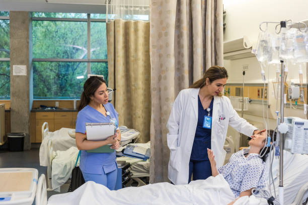 istock Female doctor talks to her patient 1463443364