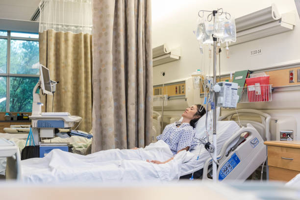 istock Female patient lies in bed 1463443373