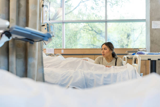 istock Exhausted family member sits bedside 1463443461