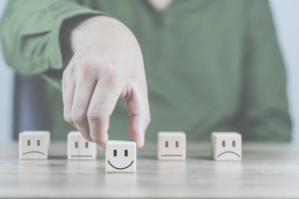 istock Customer service and Satisfaction concept a cube wood doing online assessments in the satisfaction rating the popular service company allows customers in order to improve and develop the organization 1463443462