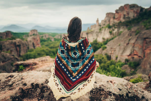 Embrace the moment! Young boho woman meditating in the nature. Shaman woman with arms outstretched. native american ethnicity stock pictures, royalty-free photos & images