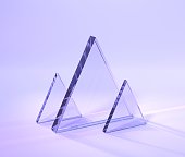 Glass plates with rainbow effect of light refraction prism or crystal 3d render. Transparent triangular acrylic panels, holographic composition on purple abstract geometric background