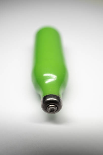 istock Close up of a Nitrous Oxide (laughing gas) canister against a white background. 1463449863