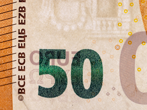 Fifty euros orange color photographed close-up, details of the genuine 50 euro banknote of the European Union