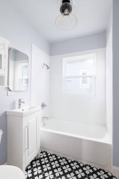 istock A bathroom with a white cabinet and pattern tile floor. 1463452460