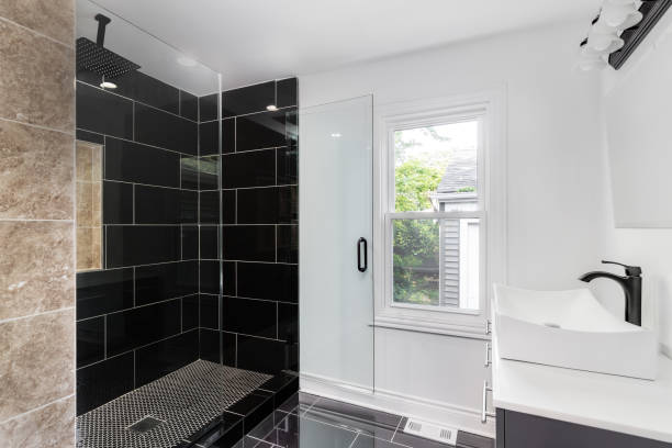 istock A bathroom with a black tiled shower. 1463452480