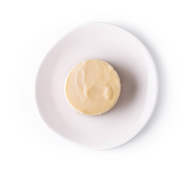 istock Lemon meringue tart on white plate top view 1463457446