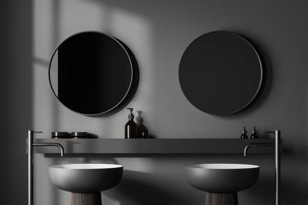 istock Grey bathroom interior with washbasins and mirror, accessories on shelf 1463457793