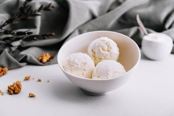 istock Vanilla ice cream balls with walnut 1463457837
