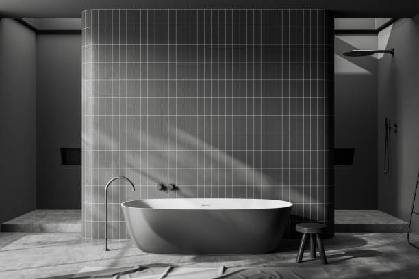 istock Front view on dark bathroom interior with large bathtub 1463457892