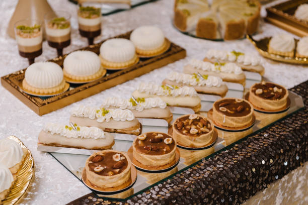 istock Candy bar with desserts for celebrating birthday, baptism, wedding. Table with cake, sweets, candies, dessert. 1463458486