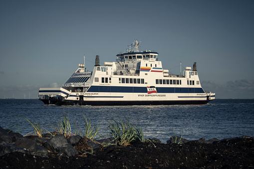 Wyk, Germany - October 09, 2022: The ferry Schleswig-Holstein on the way to the North Frisian island of Foehr on a splendid day in autumn. The Schleswig-Holstein was built in 2011 at the Neptun shipyard in Rostock and belongs to the Wyker Dampfschiffs-Reederei Foehr-Amrum