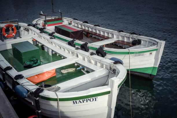 Helgoland, Germany - October 28, 2022: Two traditional so-called Boerteboote on the island of Helgoland. The Boerteboot is used to transport people in summer (“disembark”) between the sea resort ships and the pier, called the Landungsbruecke.