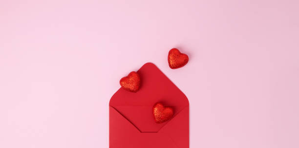 istock Valentine day holiday background with red envelope and various hearts, romantic message. Copy space. Top view 1463462086