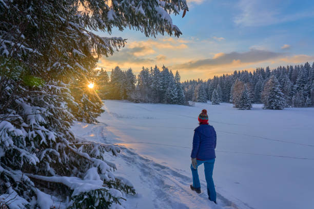 istock woman winter hiking in deep snow during sunset 1463464684