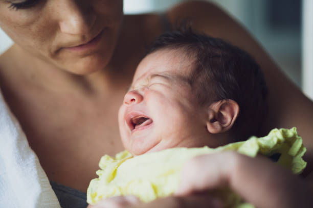 istock Mother holding newborn baby 1463465825