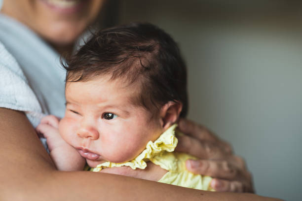 istock Mother holding newborn baby 1463466047