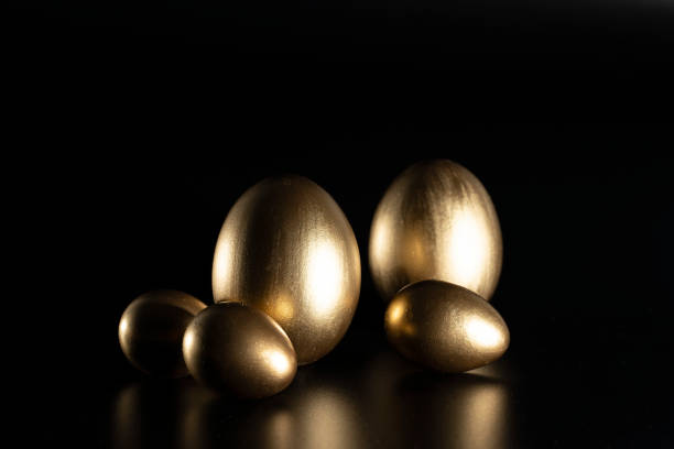 istock Easter, Gold birds eggs shot against a dark background 1463467405