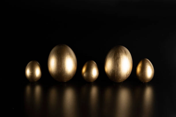 istock Easter, Gold birds eggs shot against a dark background 1463467428