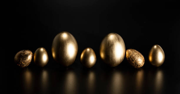 istock Easter, Gold birds eggs shot against a dark background 1463467438