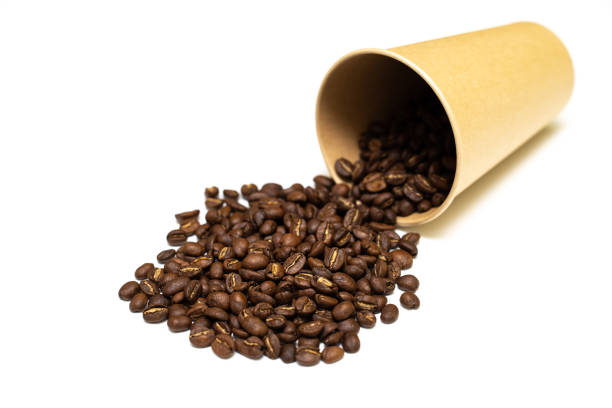 istock scattered from a glass of coffee grains on a white background 1463470160