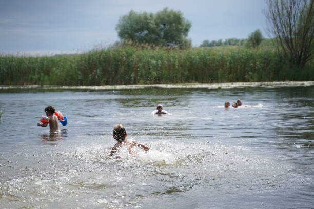 istock Children have fun in the river in the summer. Selective focus 1463470512