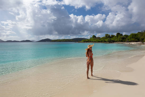 istock Woman  on tropical beach 1463472027