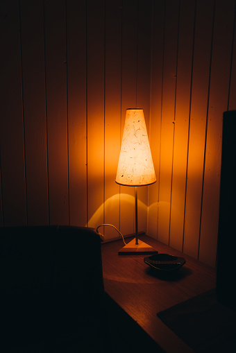 A view of an old authentic lamp inside the wooden fisherman house in Norway