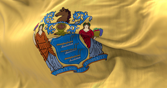 Close-up of the New Jersey state flag. Coat of arms on buff background. US state. Rippled fabric. Textured background. Realistic 3d illustration. Close-up. Selective focus