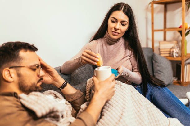 istock Sick young couple at home 1463473032