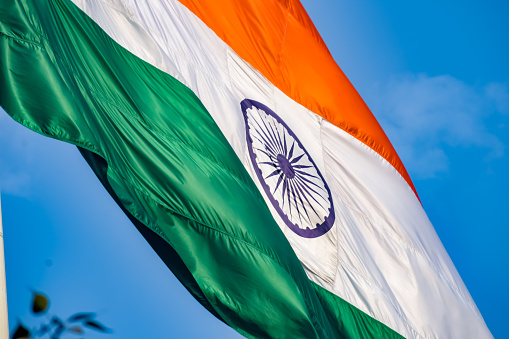 The Indian flag gracefully fluttering in the wind. This vibrant stock image captures the essence of independence, culture, and national pride as the tricolor palette dances elegantly against the sky. Each sway symbolizes the spirit of celebration and strength, creating a nation's identity. Ideal for projects that seek to evoke patriotism, commemorate historical events, or celebrate the diverse tapestry of India.