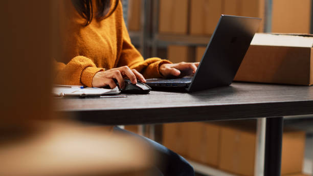 istock Startup owner working on stock inventory with laptop 1463475510