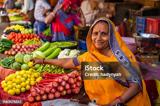 istock Indian street sellers selling vegetables in Jaipur, India 1463476542