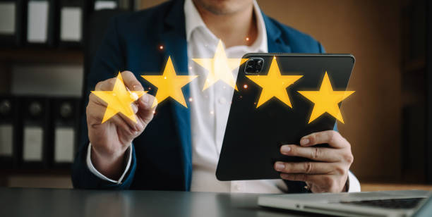 istock Customer or client the stars to complete five stars. with copy space. giving a five star rating. Service rating, satisfaction concept. 1463477298
