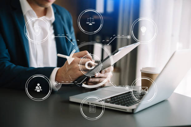istock Copyright or patent concept, Person hand using laptop computer, tablet and smartphone with virtual screen copyright icon trademark, Creation ownership against piracy. 1463477330