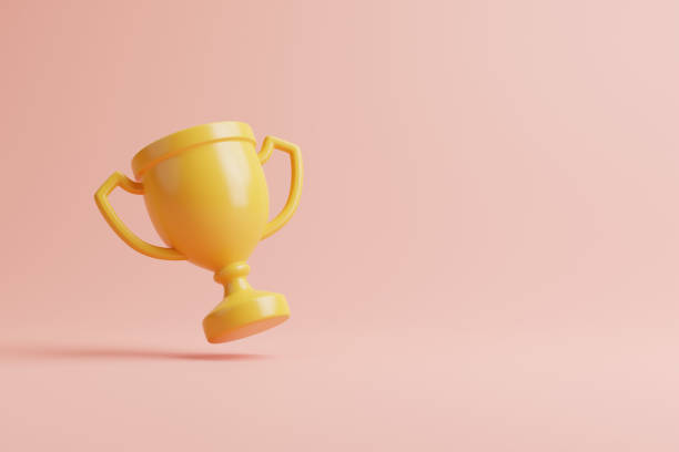 istock Champion cup, winners trophy floating on pink background with copy space 1463478123